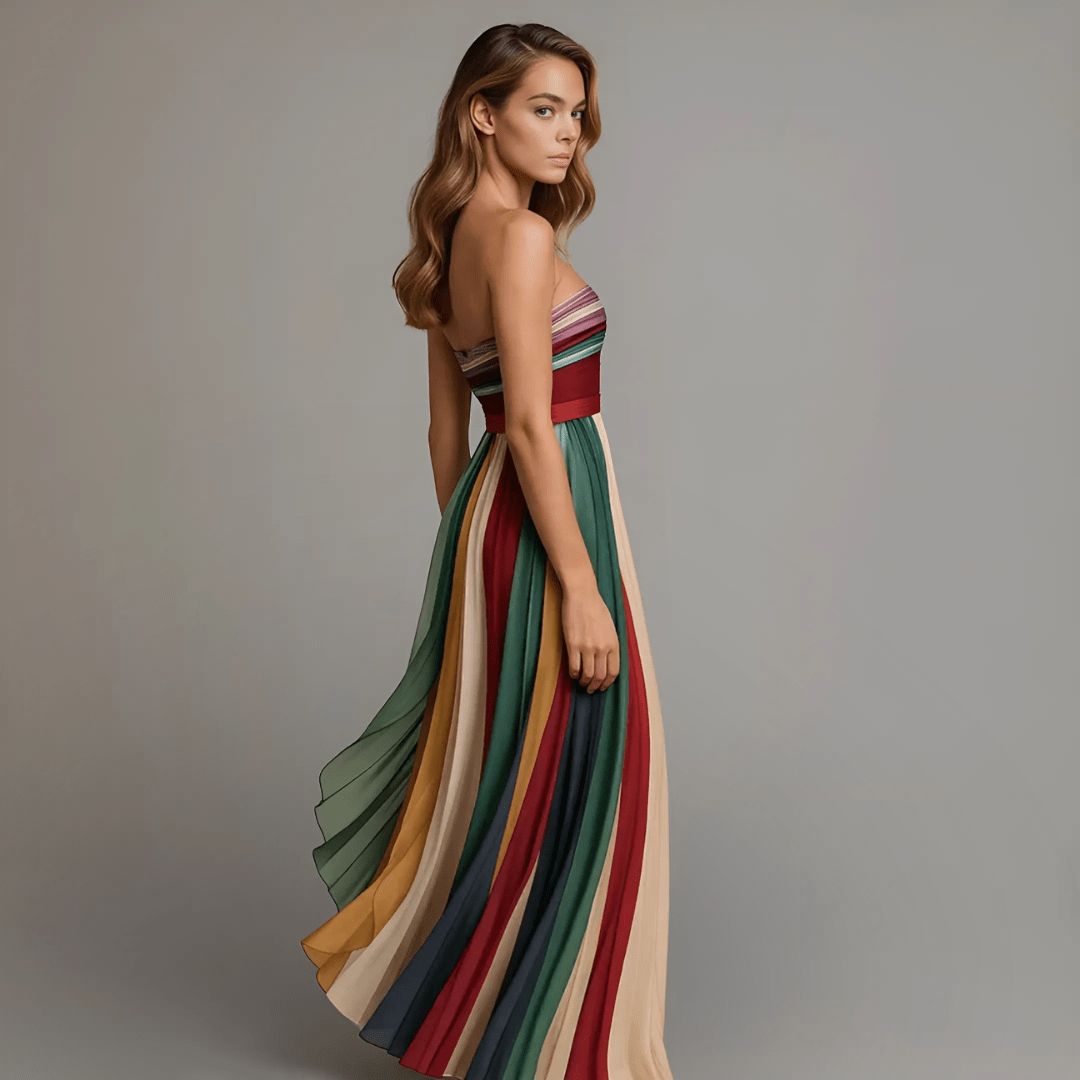 Plus size women's maxi dress featuring a vibrant, colorful strapless design with elegant pleats, perfect for summer occasions. 2
