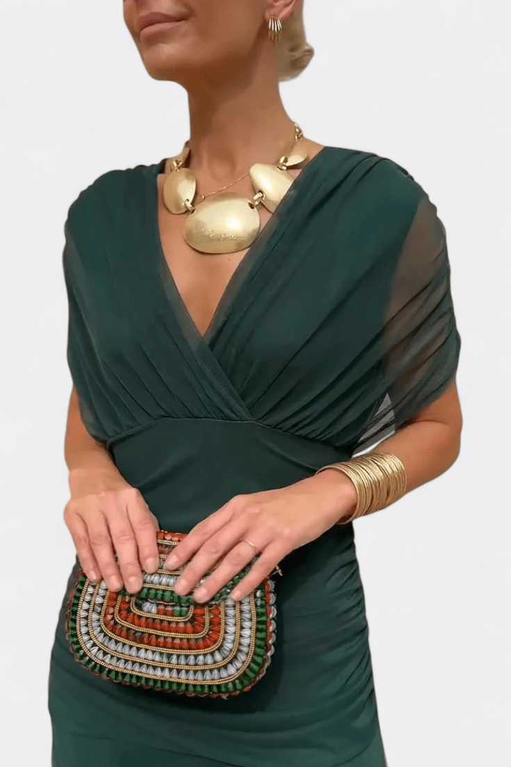 Elegant women's maxi dress featuring a flattering V-neck and flowing sleeves, perfect for both casual outings and formal events. 11