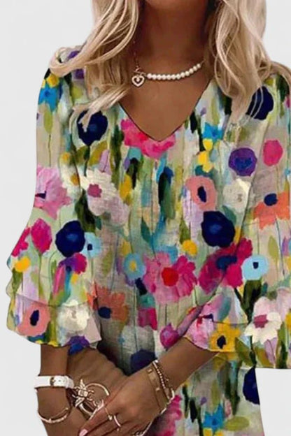 Women's plus size mini dress featuring a flattering V-neckline and vibrant floral print, perfect for summer outings and casual events. 2