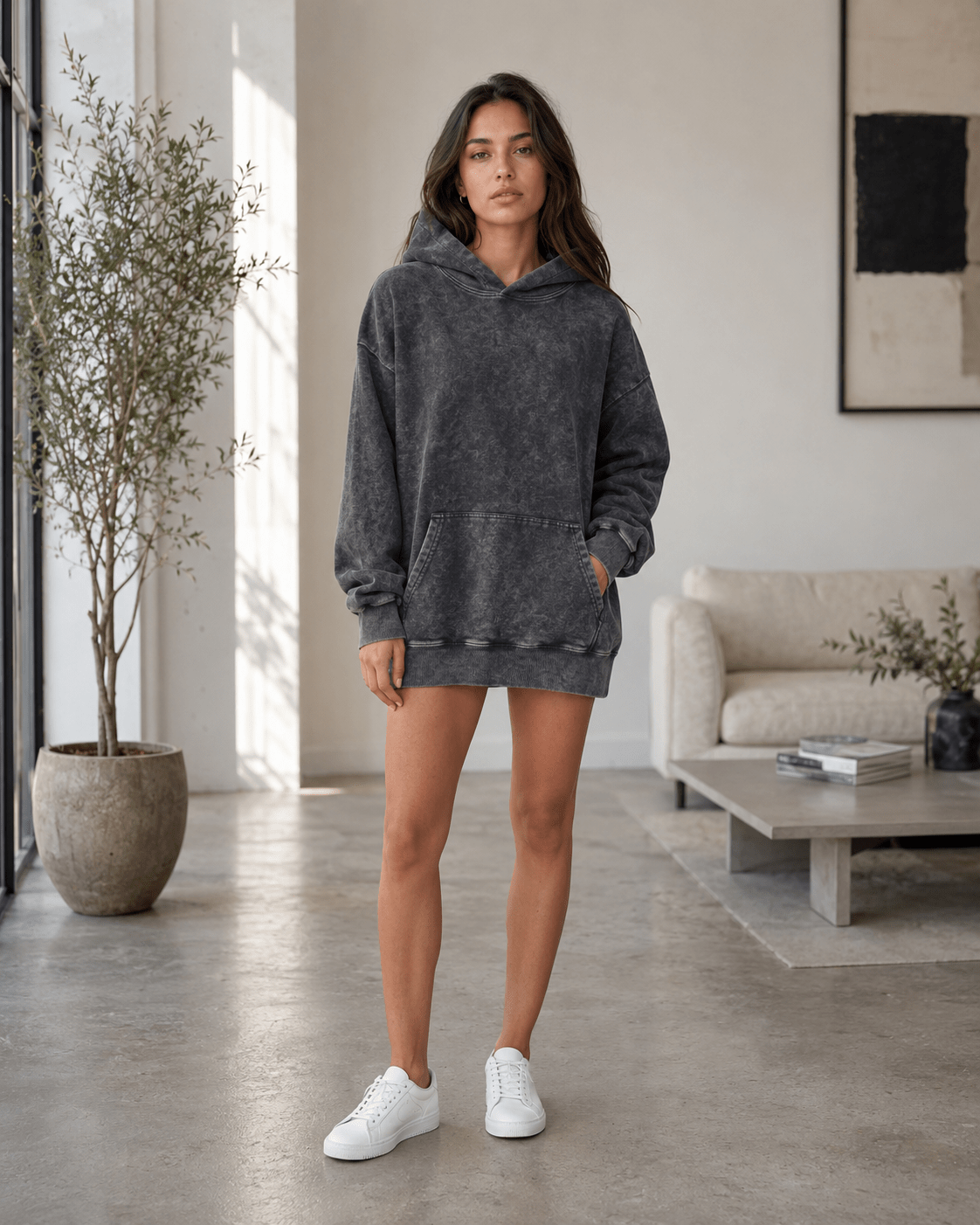 Women's oversized hoodie in washed black featuring a kangaroo pocket, perfect for casual wear and layering in any season. 0