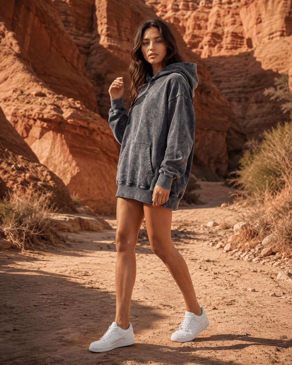 Women's oversized hoodie in washed black featuring a kangaroo pocket, perfect for casual wear and layering in any season. 2