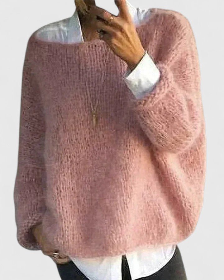 Women's oversized sweater in soft fabric, featuring a relaxed fit for casual comfort, available in a stylish pink color. 0