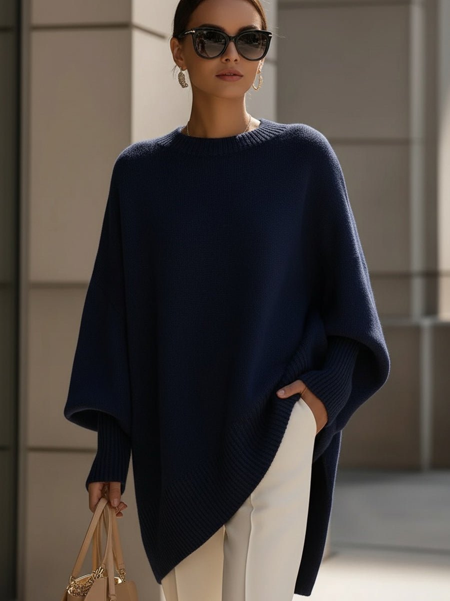 Women's oversized sweater in beige with an asymmetrical hem, made from a cozy wool blend, perfect for stylish layering and comfort in cooler weather. 6