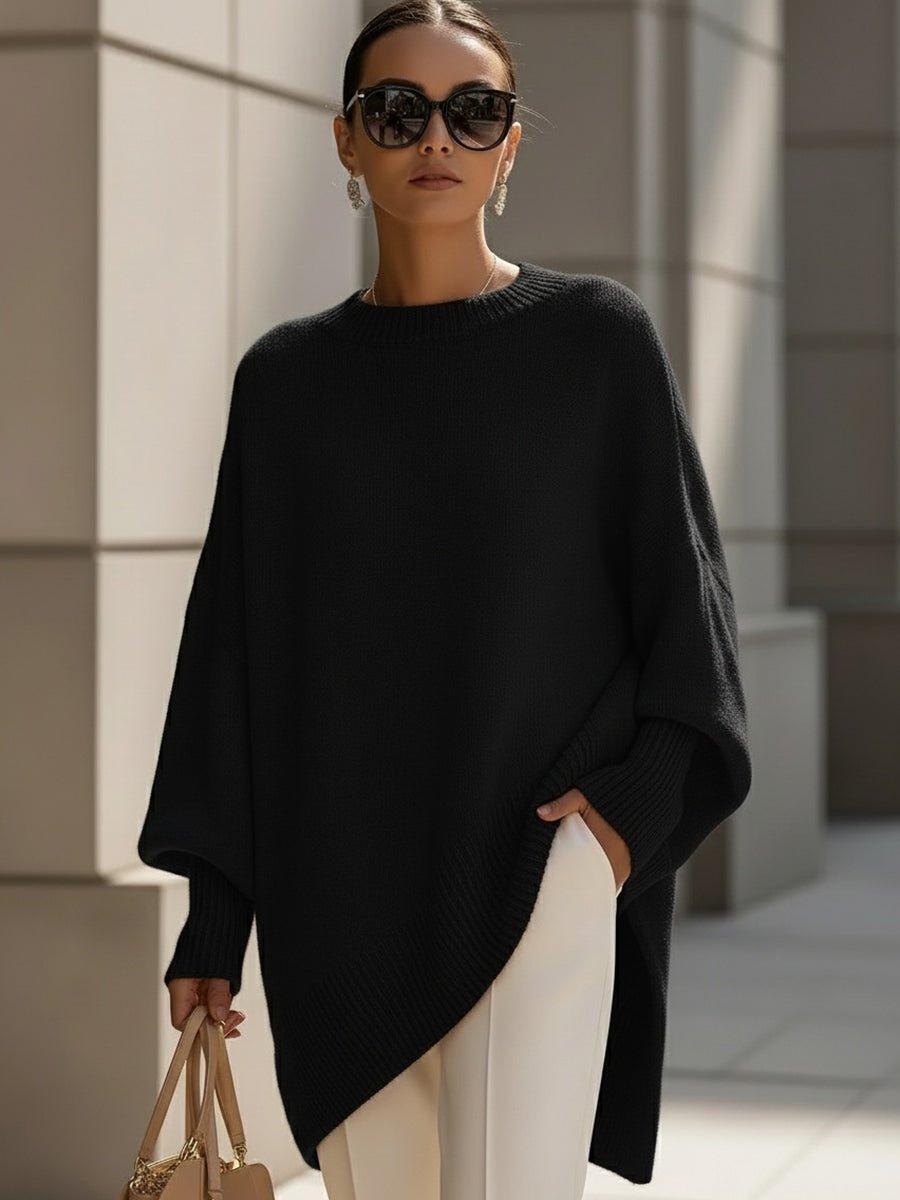 Women's oversized sweater in beige with an asymmetrical hem, made from a cozy wool blend, perfect for stylish layering and comfort in cooler weather. 9