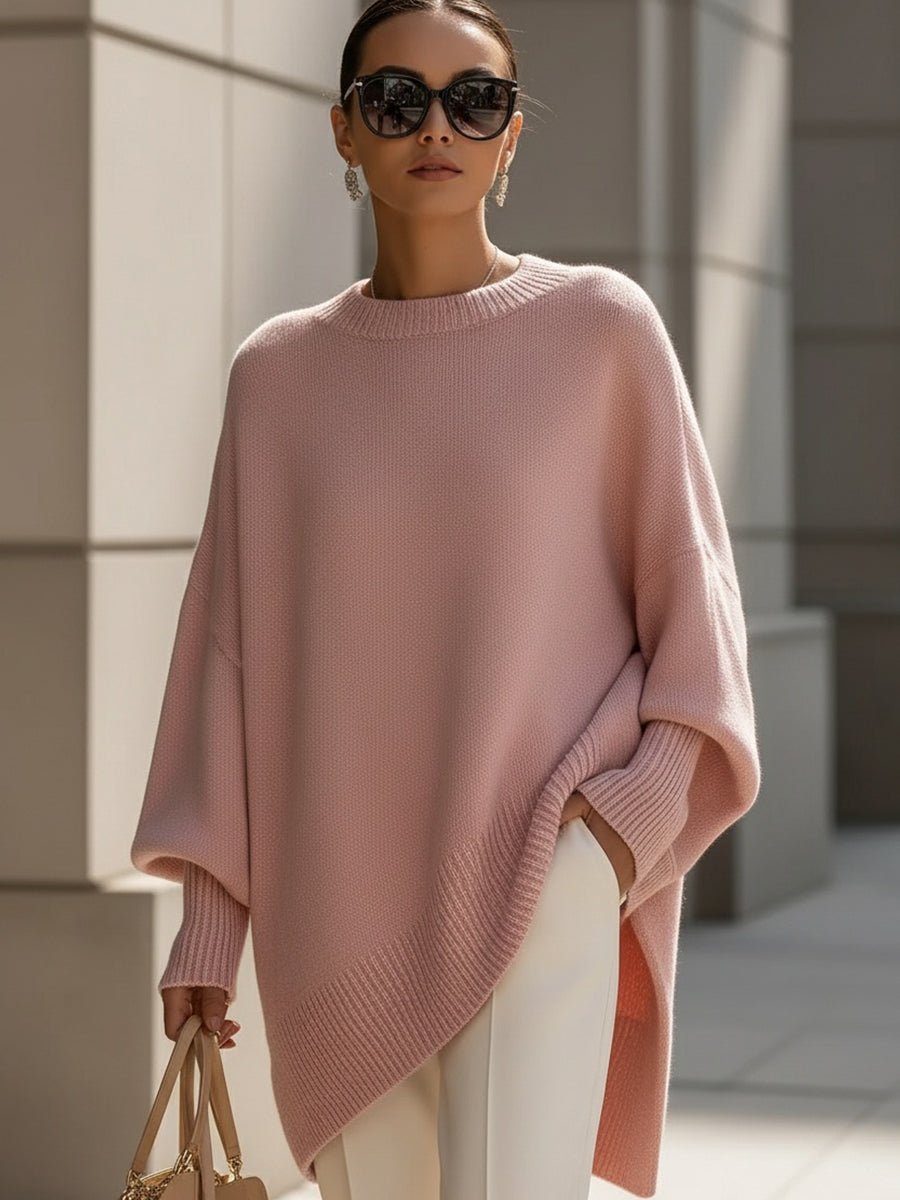 Women's oversized sweater in beige with an asymmetrical hem, made from a cozy wool blend, perfect for stylish layering and comfort in cooler weather. 5