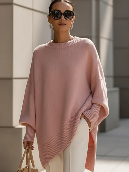 Women's oversized sweater in beige with an asymmetrical hem, made from a cozy wool blend, perfect for stylish layering and comfort in cooler weather. 5