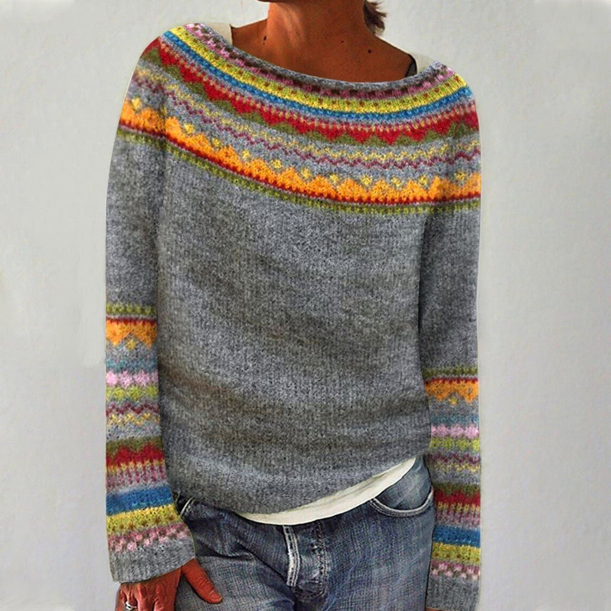 Women's oversized sweater featuring a wide boat neckline, cozy retro striped design, and soft knit fabric, perfect for casual and comfortable style. 1