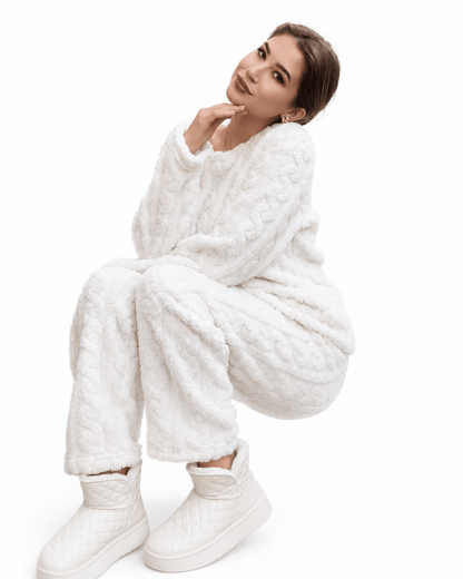 Women's winter pajama set featuring a cozy long sleeve top and matching bottoms made from plush fabric, perfect for warm and comfortable nights. 2