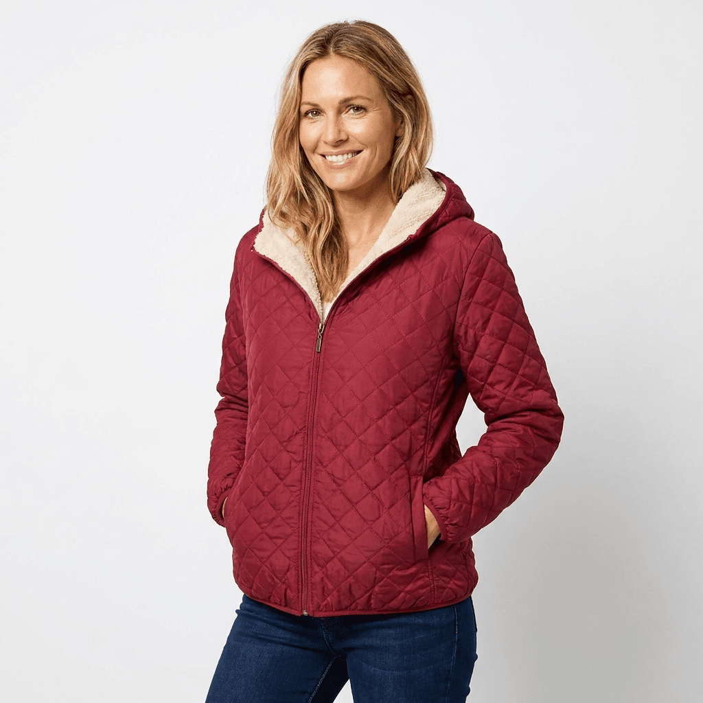 Women's quilted jacket featuring a fleece-lined hood and zip-up closure, designed for warmth and style, perfect for winter wear. 4