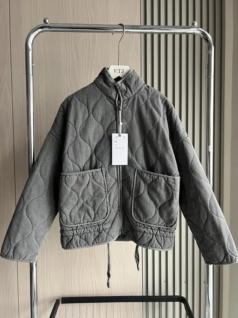 Women's vintage cotton quilted jacket featuring a high collar and practical pockets, perfect for winter warmth and style. 1