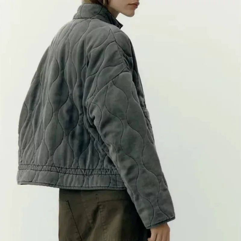 Women's vintage cotton quilted jacket featuring a high collar and practical pockets, perfect for winter warmth and style. 4