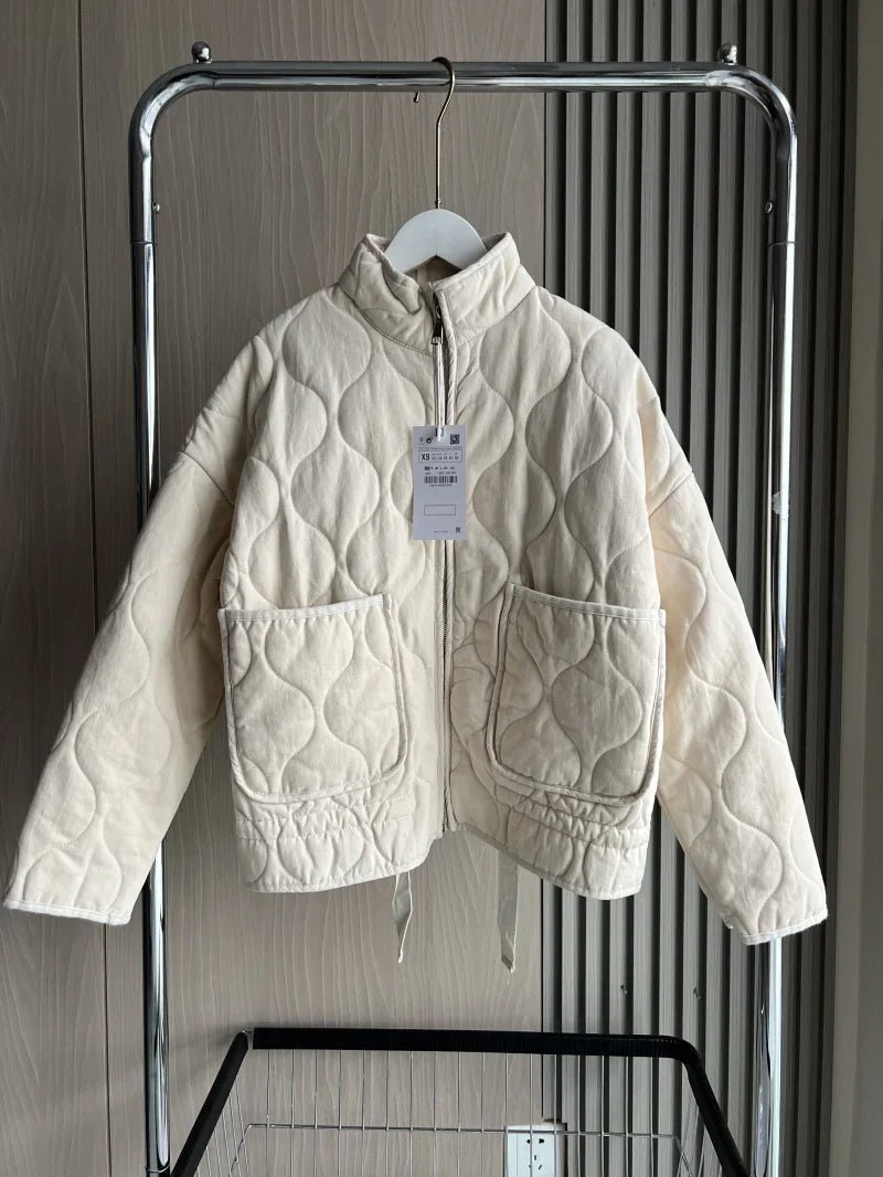 Women's vintage cotton quilted jacket featuring a high collar and practical pockets, perfect for winter warmth and style. 0