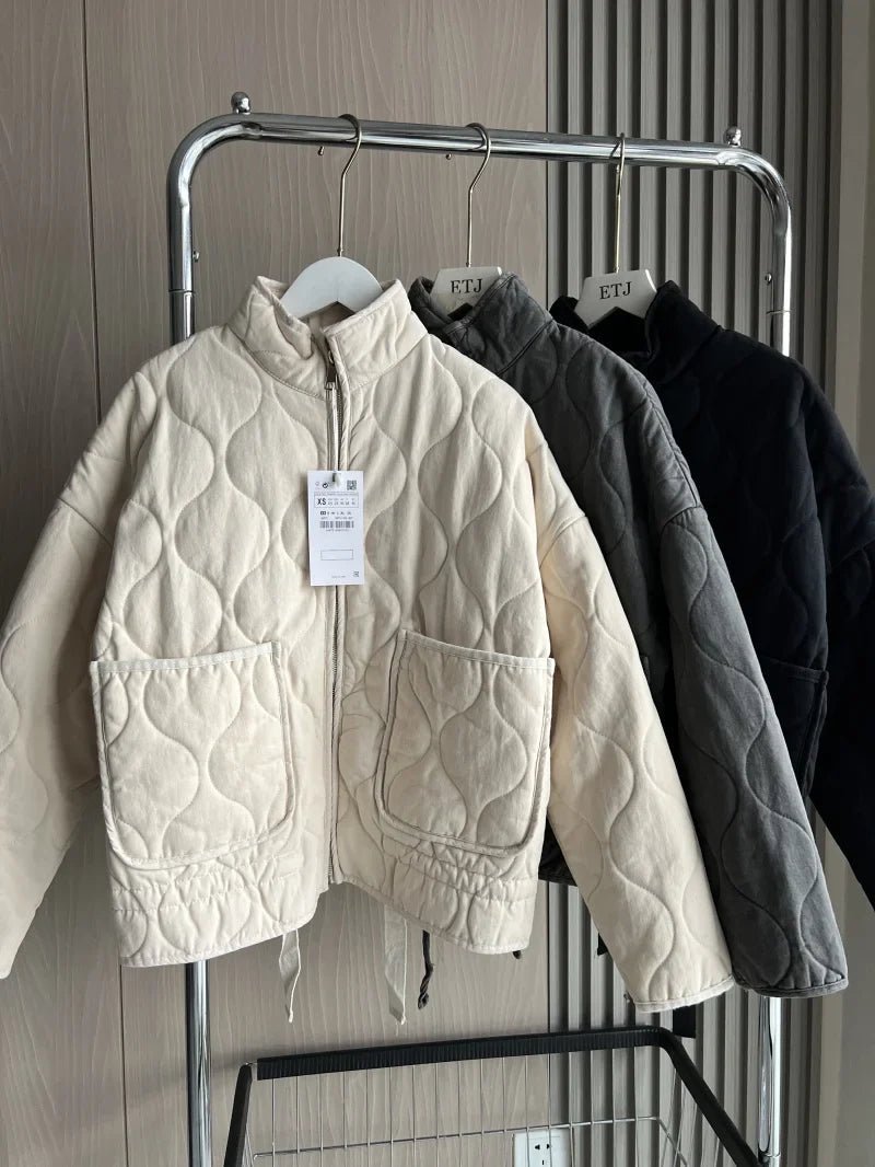 Women's vintage cotton quilted jacket featuring a high collar and practical pockets, perfect for winter warmth and style. 2