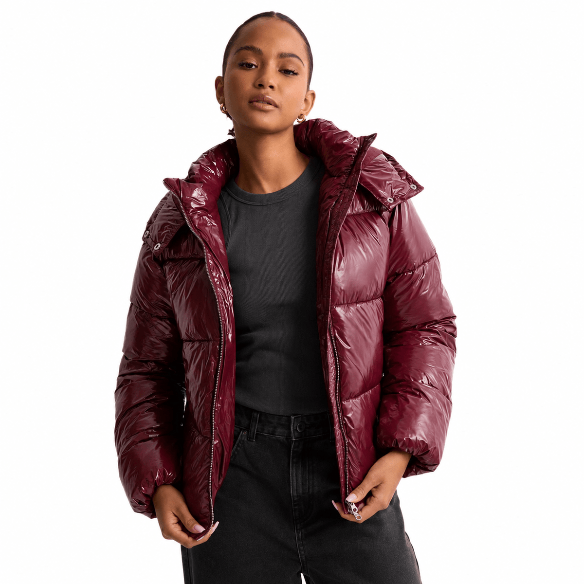 Women's quilted jacket featuring a removable hood, water-repellent fabric, and a modern design, perfect for stylish winter wear. 1
