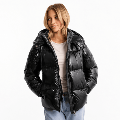 Women's quilted jacket featuring a removable hood, water-repellent fabric, and a modern design, perfect for stylish winter wear. 0