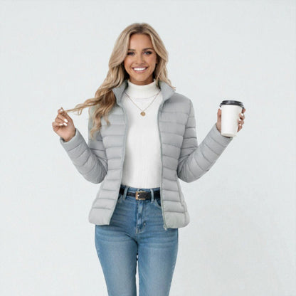 Women's lightweight quilted jacket in a slim fit, featuring a stylish neutral tone, perfect for casual outings and versatile layering. 6