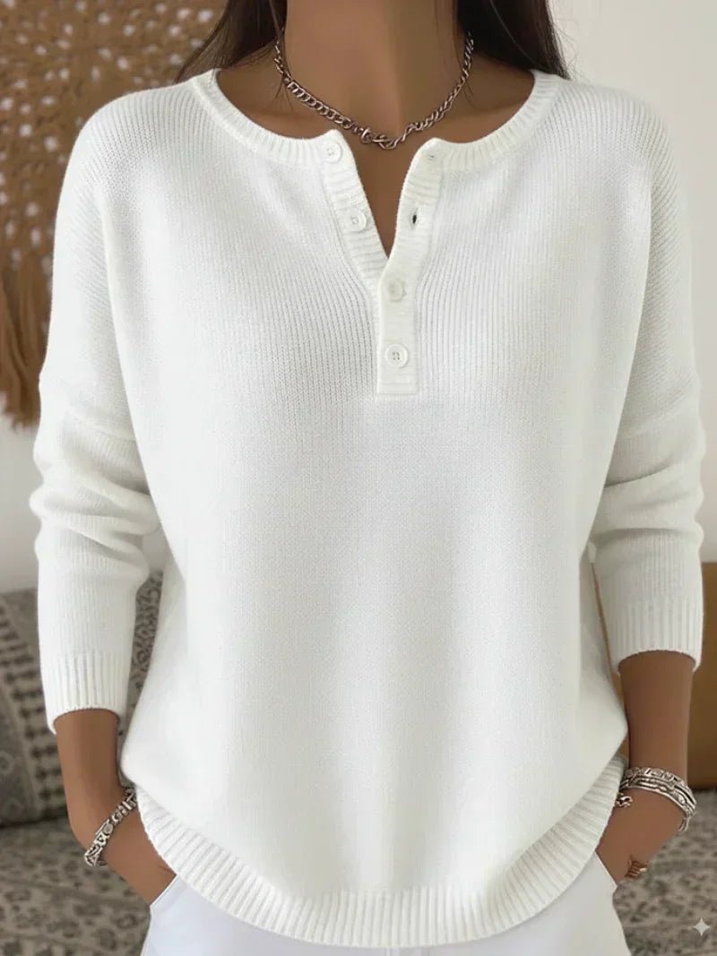 Women's cream ribbed knitted jumper featuring a stylish Henley neckline and side slits, designed for a relaxed fit. 5