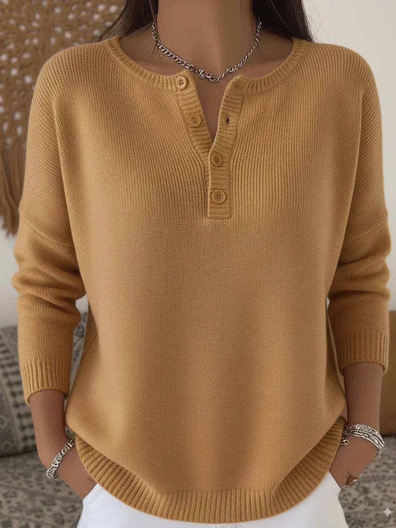 Women's cream ribbed knitted jumper featuring a stylish Henley neckline and side slits, designed for a relaxed fit. 6