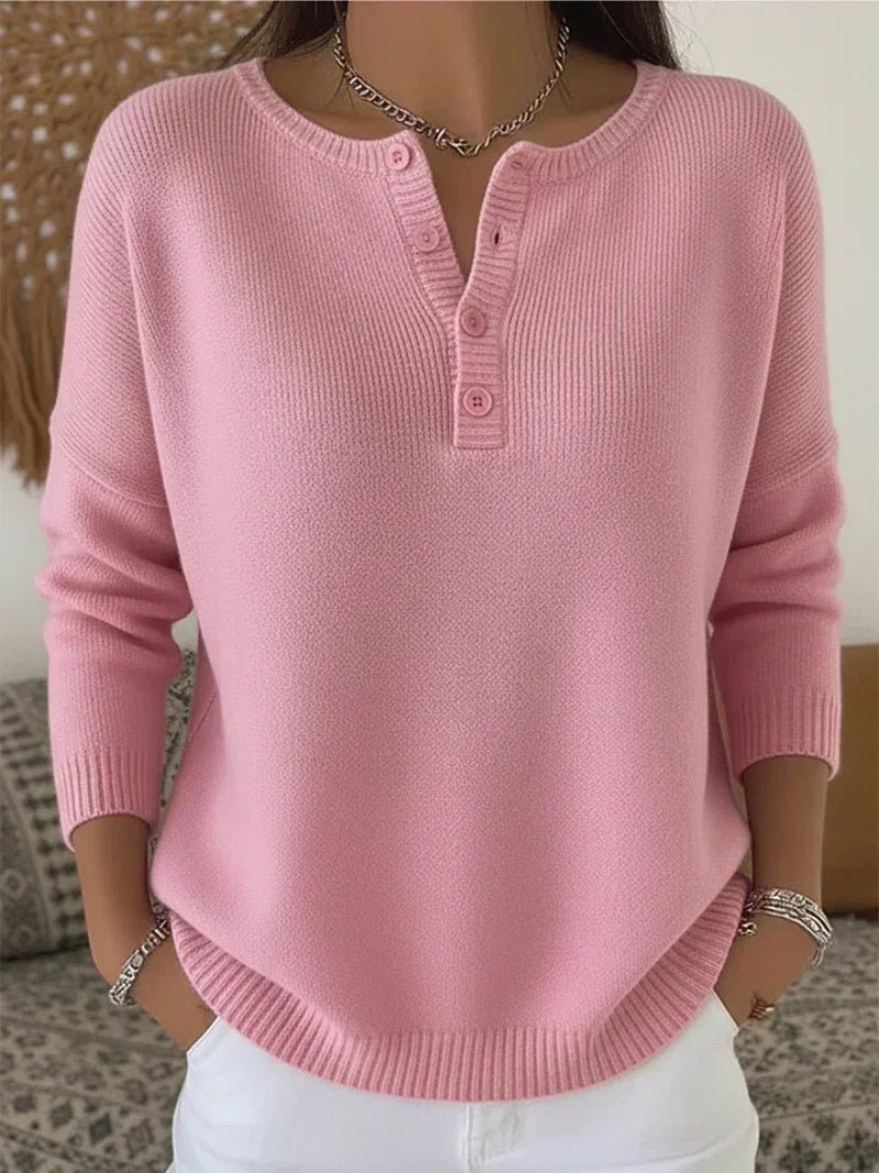 Women's cream ribbed knitted jumper featuring a stylish Henley neckline and side slits, designed for a relaxed fit. 4