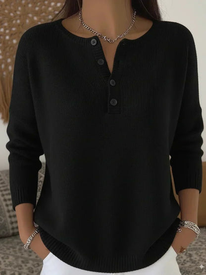 Women's cream ribbed knitted jumper featuring a stylish Henley neckline and side slits, designed for a relaxed fit. 3