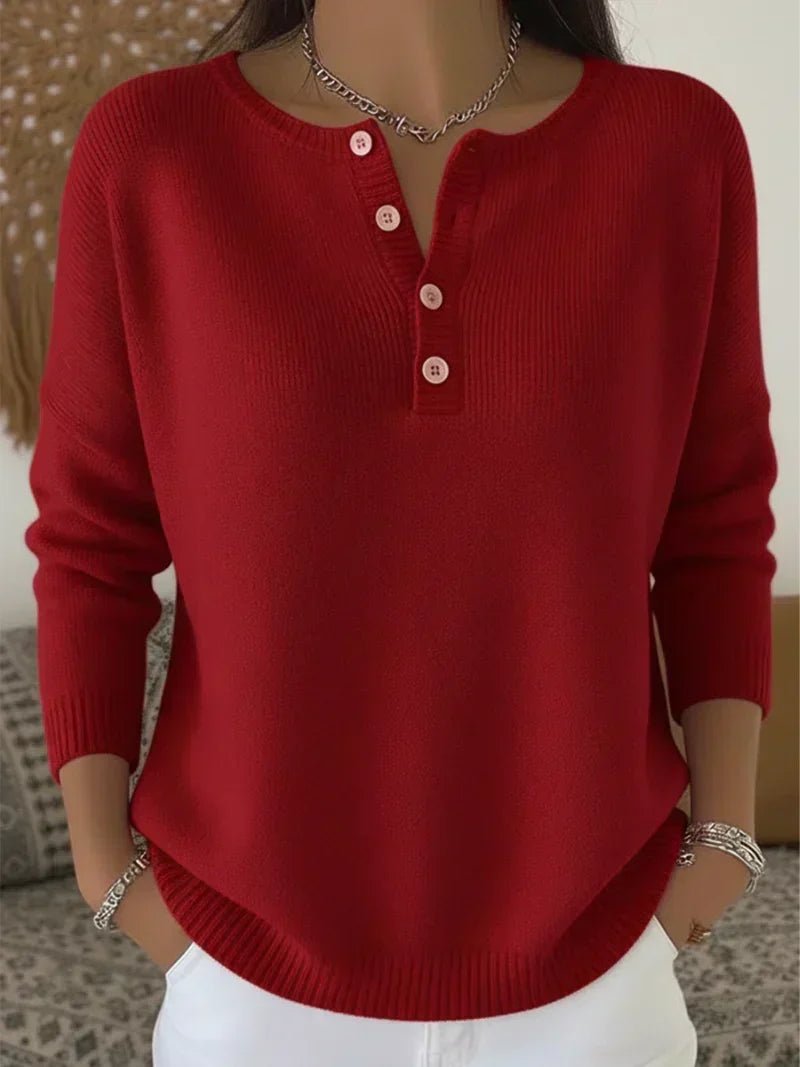 Women's cream ribbed knitted jumper featuring a stylish Henley neckline and side slits, designed for a relaxed fit. 2