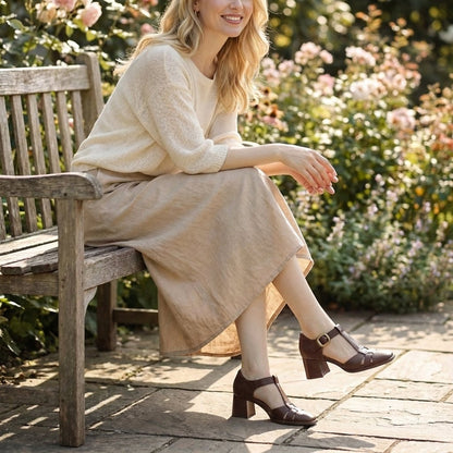 Women's sandals featuring a chunky heel and stylish T-strap design, perfect for comfortable summer footwear. 1
