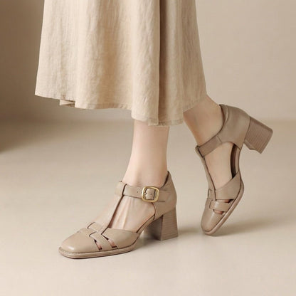 Women's sandals featuring a chunky heel and stylish T-strap design, perfect for comfortable summer footwear. 0