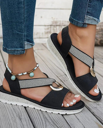 Women's sandals featuring a cushioned footbed and adjustable buckle, designed with a low wedge and open toe for comfort and style. 6