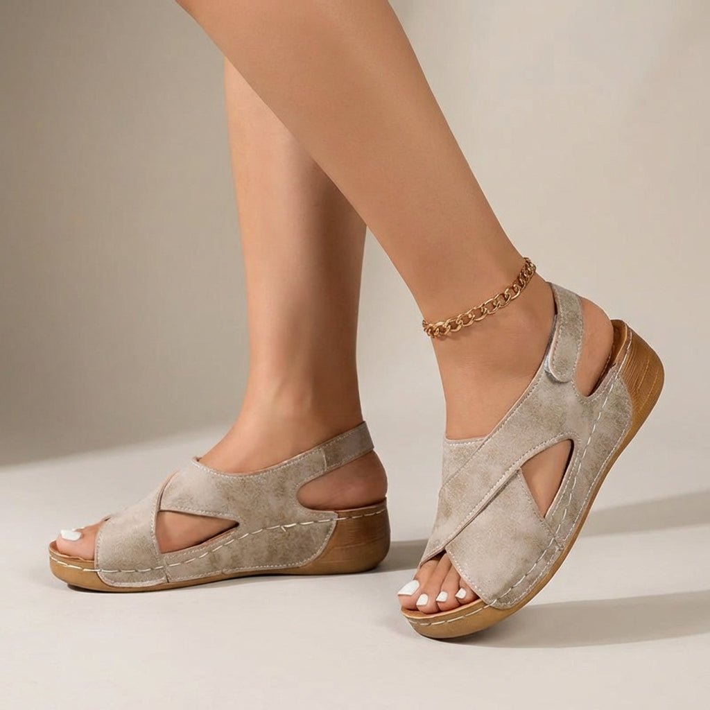 Women's orthopedic slingback sandals featuring a criss-cross design and comfortable wedge heel, perfect for summer outings. 0
