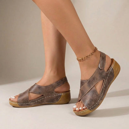 Women's orthopedic slingback sandals featuring a criss-cross design and comfortable wedge heel, perfect for summer outings. 3