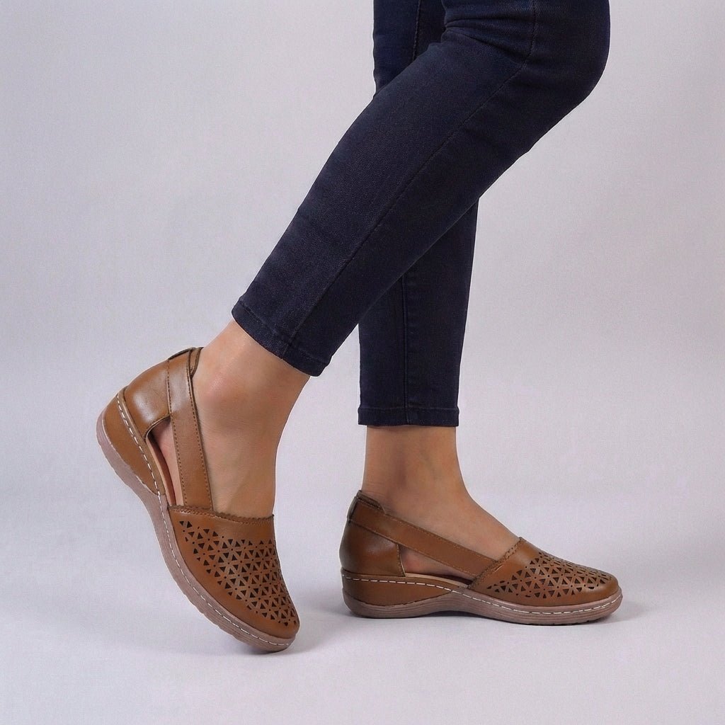 Women's sandals featuring a scalloped cut-out design, designed for summer comfort with breathable materials and orthopedic support, perfect for slip-on wear. 1