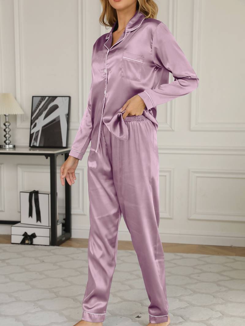 Women's satin pajama set featuring a button-up blouse and long trousers, designed for elegant sleepwear and year-round comfort. 1