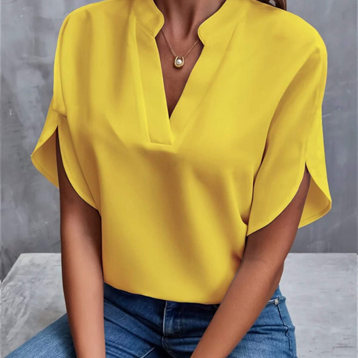 Women's short sleeve blouse made from lightweight polyester, perfect for summer wear, featuring a stylish design and versatile fit suitable for various occasions. 2
