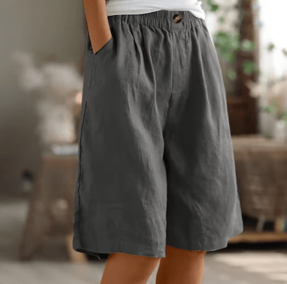 Womens shorts with elastic waistband in breathable fabric, mid-thigh length design for all-day comfort and versatility. 1