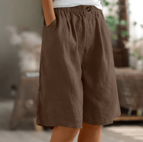 Womens shorts with elastic waistband in breathable fabric, mid-thigh length design for all-day comfort and versatility. 11