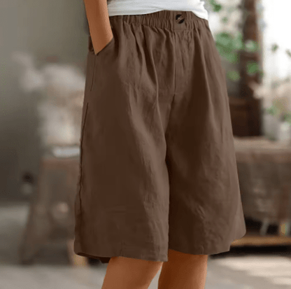 Womens shorts with elastic waistband in breathable fabric, mid-thigh length design for all-day comfort and versatility. 11