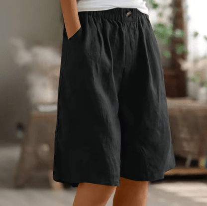 Womens shorts with elastic waistband in breathable fabric, mid-thigh length design for all-day comfort and versatility. 12