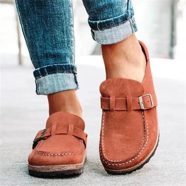 Women's black slip-on loafers featuring a modern buckle design, cushioned sole, and platform for enhanced comfort and style. 5
