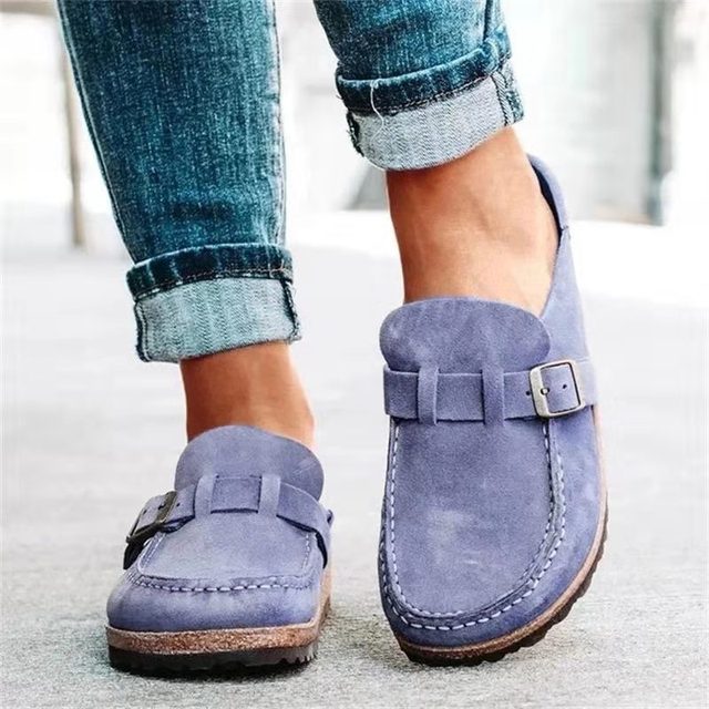 Women's black slip-on loafers featuring a modern buckle design, cushioned sole, and platform for enhanced comfort and style. 3