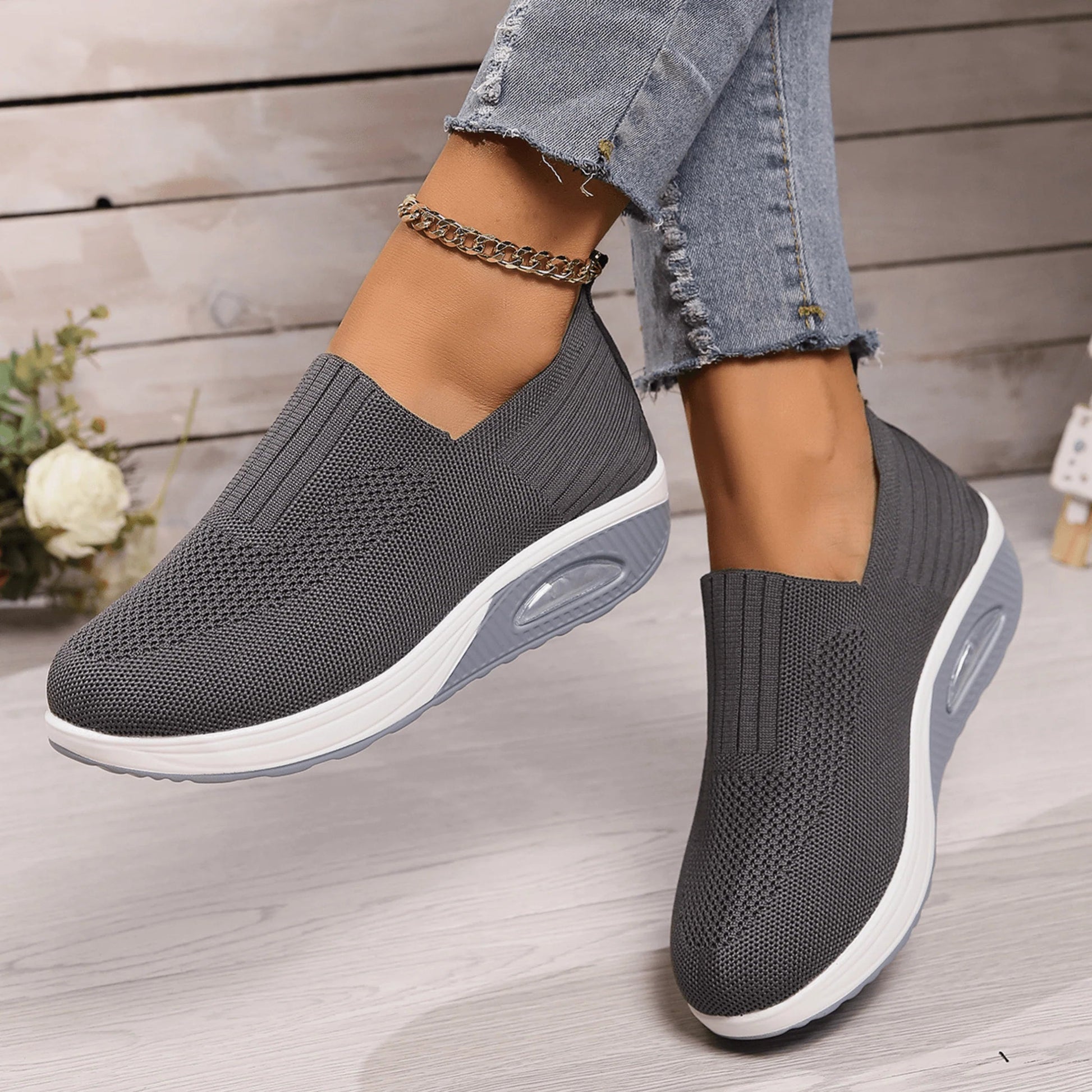 Women's slip-on sneakers in white, featuring a breathable design and flexible support, perfect for sporty minimalist style. 3