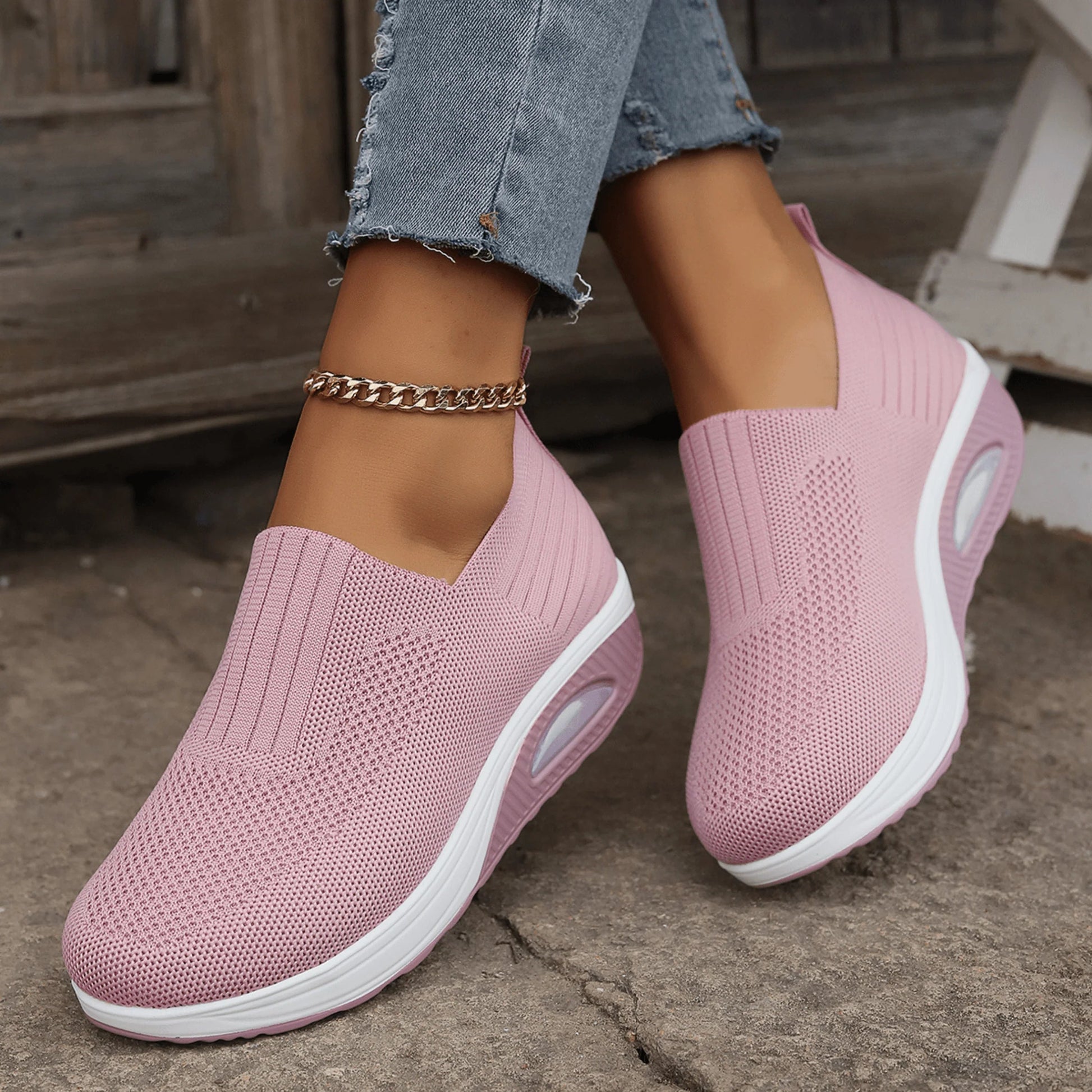 Women's slip-on sneakers in white, featuring a breathable design and flexible support, perfect for sporty minimalist style. 4