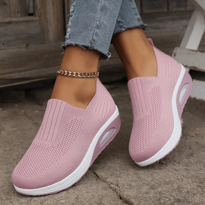 Women's slip-on sneakers in white, featuring a breathable design and flexible support, perfect for sporty minimalist style. 4