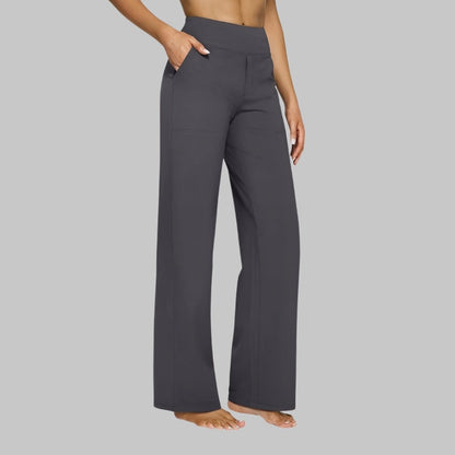 Women's stretch pants featuring a high waist design and deep pockets, crafted for comfort with wrinkle-free fabric, perfect for casual outings and workouts. 3