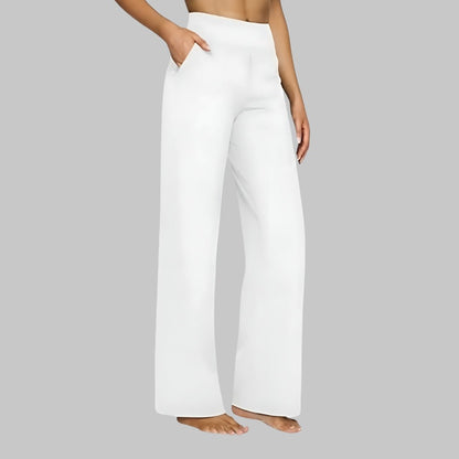 Women's stretch pants featuring a high waist design and deep pockets, crafted for comfort with wrinkle-free fabric, perfect for casual outings and workouts. 5