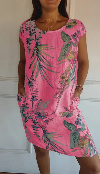 Women's summer dress featuring a vibrant botanical print, designed with convenient pockets, made from a lightweight cotton-linen blend for a relaxed fit, perfect for warm 6
