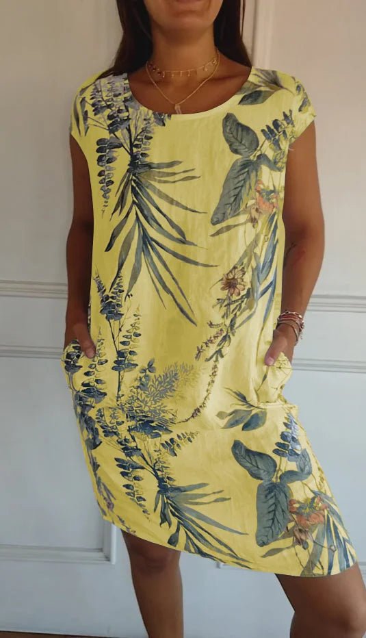 Women's summer dress featuring a vibrant botanical print, designed with convenient pockets, made from a lightweight cotton-linen blend for a relaxed fit, perfect for warm 8