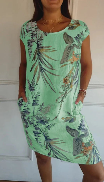 Women's summer dress featuring a vibrant botanical print, designed with convenient pockets, made from a lightweight cotton-linen blend for a relaxed fit, perfect for warm 5