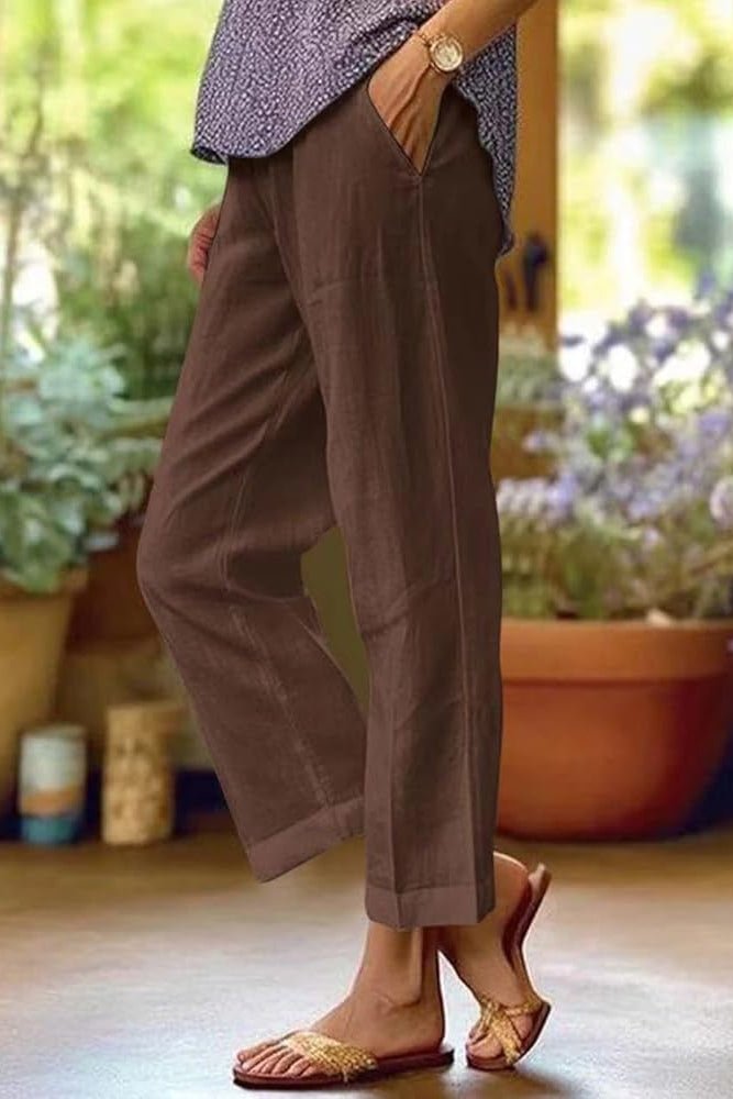 Womens summer pants with a relaxed fit, featuring hidden pockets, designed for lightweight comfort and breathability in warm weather. 1