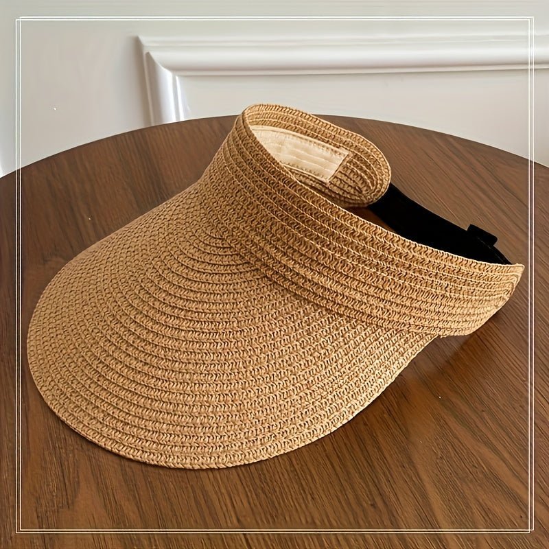 Women's sun visor with a wide brim for UV protection, featuring an adjustable and lightweight foldable design, perfect for outdoor activities and sunny days. 1