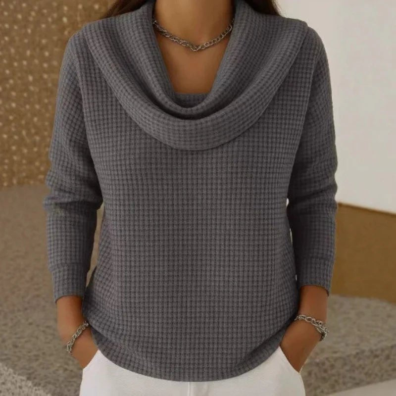 Women's blue sweater featuring a cowl neck design, made from soft waffle knit fabric for cozy warmth, with an elegant flowing fit perfect for stylish layering. 3